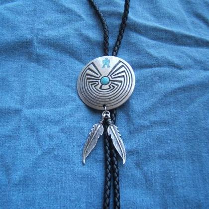 Man In Maze Bolo Tie With Feathers, Silver Bolo..